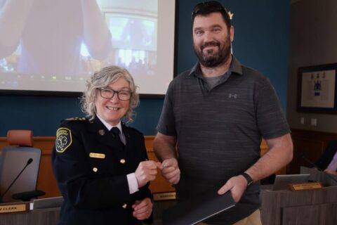 Mark Sherwin receives a Chief’s commendation from Frontenac Paramedics Chief Gale Chevalier