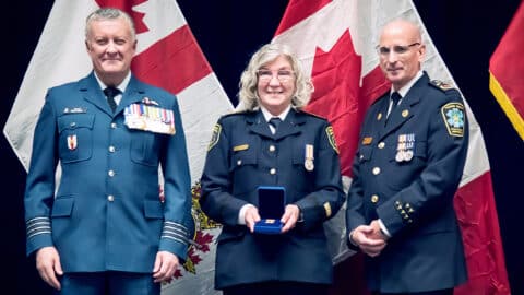 Gale Chevalier (Center) received her Governor General’s Emergency Medical Services Exemplary Service Medal First Bar from Canadian Forces College Deputy Commandant Colonel Shayne Elder, and Ontario Association of Paramedic Chiefs President Chief Greg Sage