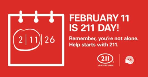 Promotional sign. Text: Feb 11 is 211 Day! Remember, you're not alone. Help starts with 211.